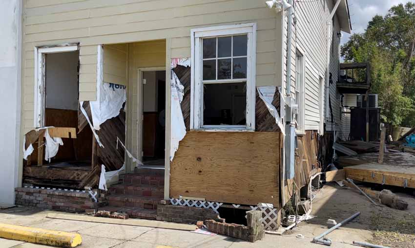 Old Mandeville storefront damage